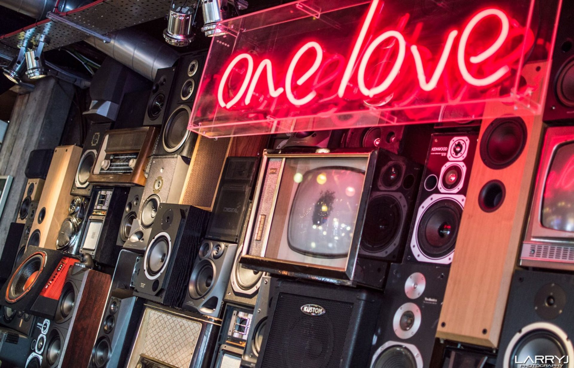 Cheltenham interior one love neon speaker wall